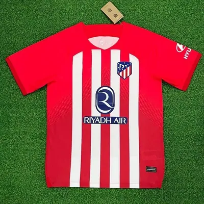 A red and white striped football shirt with a sponsor print
