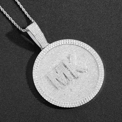 A round pave-set pendant on a silver chain